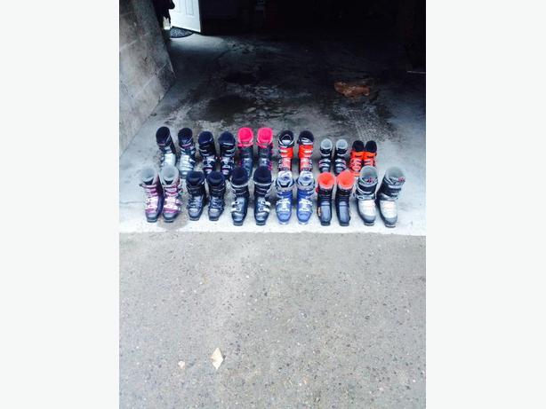 Downhill ski boots and skis - many sizes